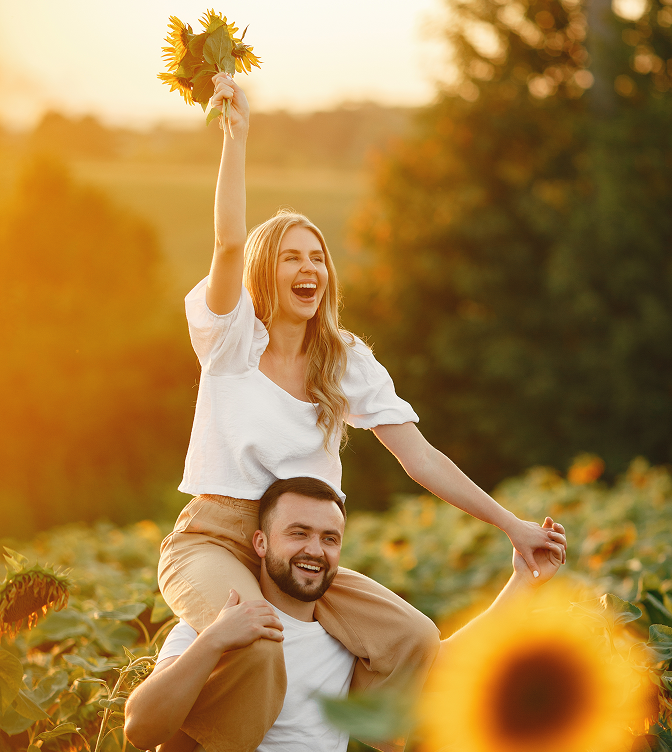 Happy couple in sunflower field