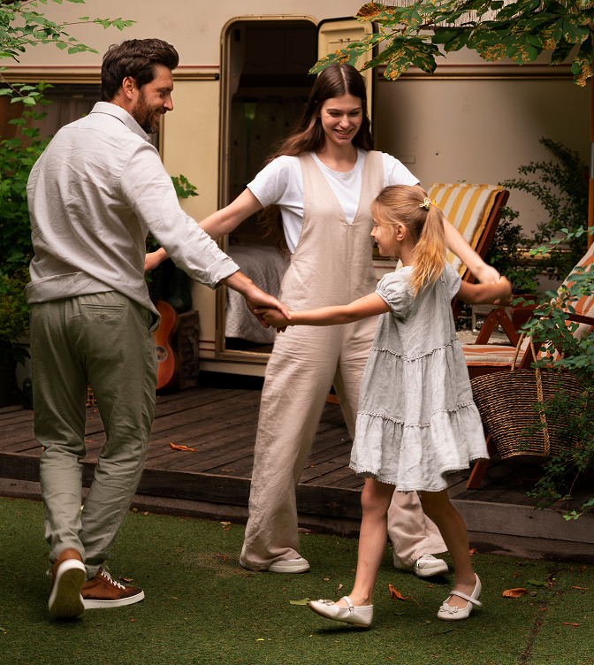 Happy family dancing together